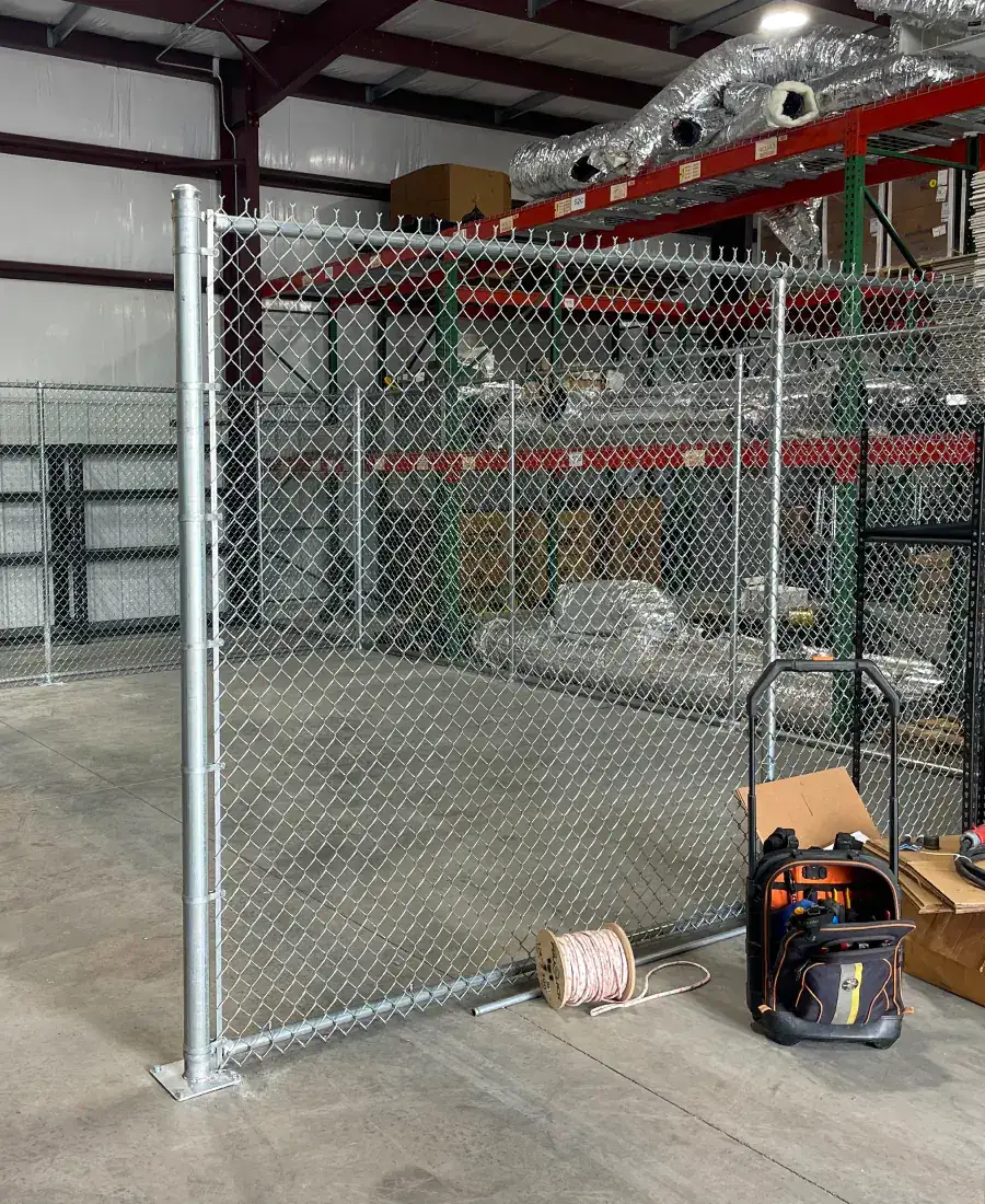 Chain link enclosure inside a warehouse
