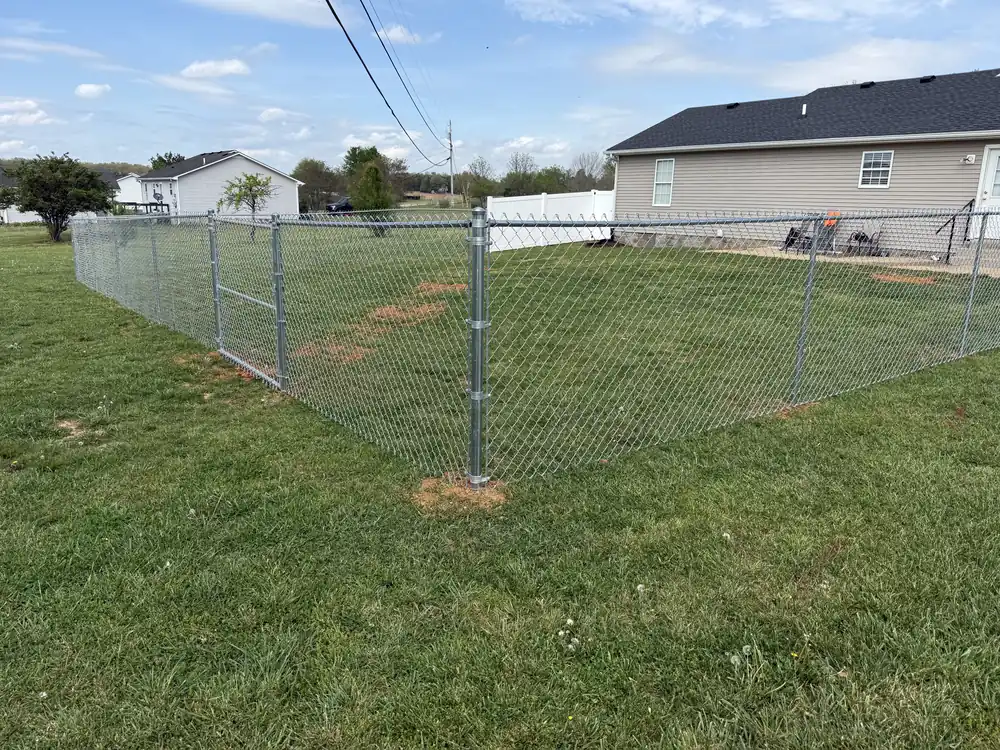 Galvanized chain link fence around a yard