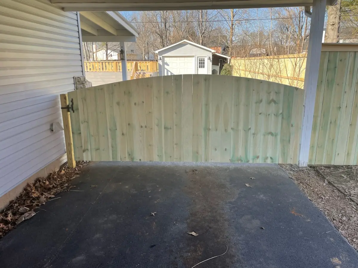 Arched wood driveway gate