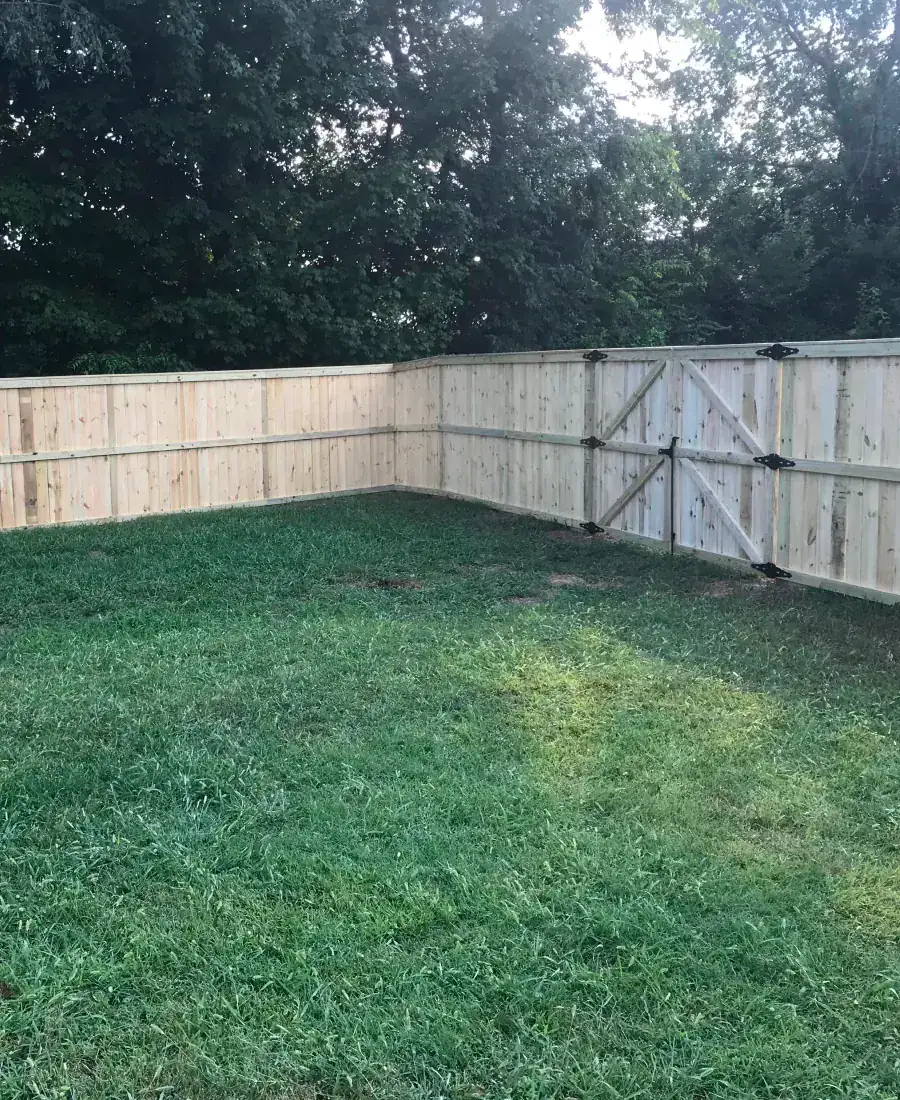 Wood privacy fence with double gate